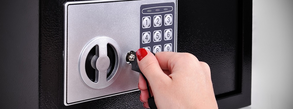 a woman's hand tuning a safe key