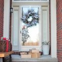 Front door with christmas wreath and packages