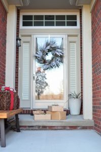 Front door with christmas wreath and packages