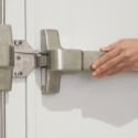 RJLock-Blog-Aug26-CommercialDoors Person's hand pushing exit bar on commercial door